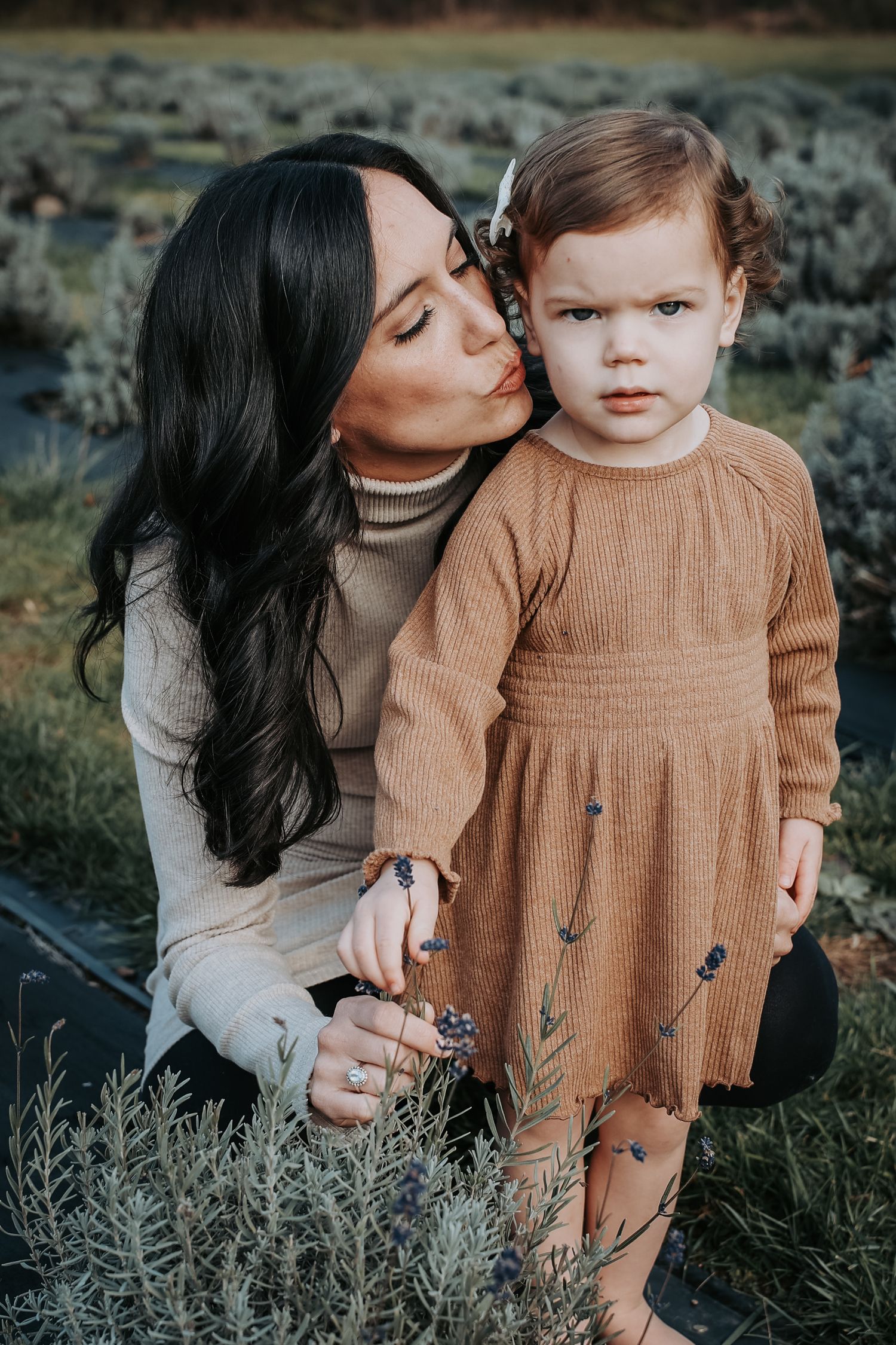 A tender outdoor family photoshoot sequence showing loving moments between parent and child in matching brown sweaters.