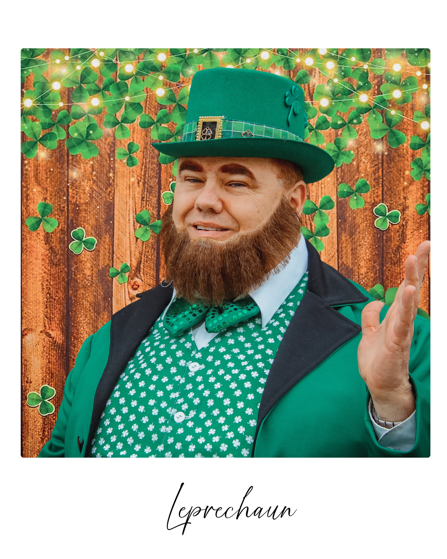 Person wearing green baseball cap and vest poses playfully against wooden fence background with shamrock decorations.