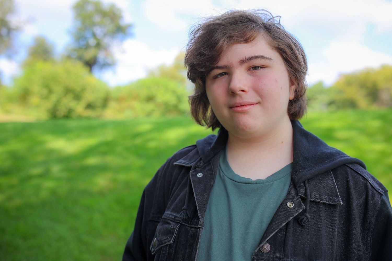 A series of outdoor portrait shots showing someone in a denim jacket and green shirt against a natural backdrop.