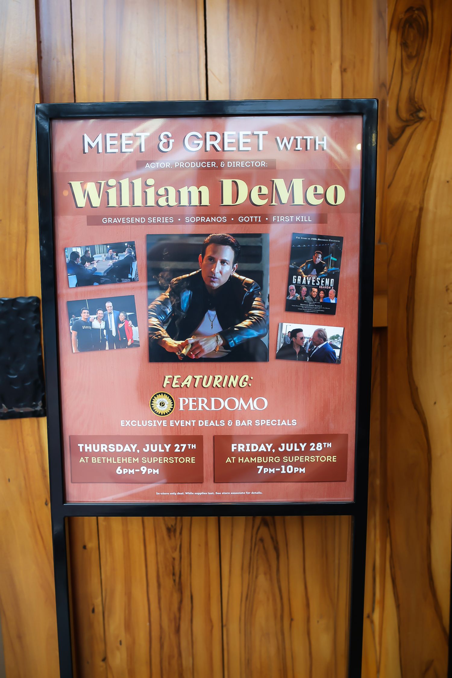 A promotional poster for a meet and greet event featuring Perdomo cigars mounted on a wooden wall.