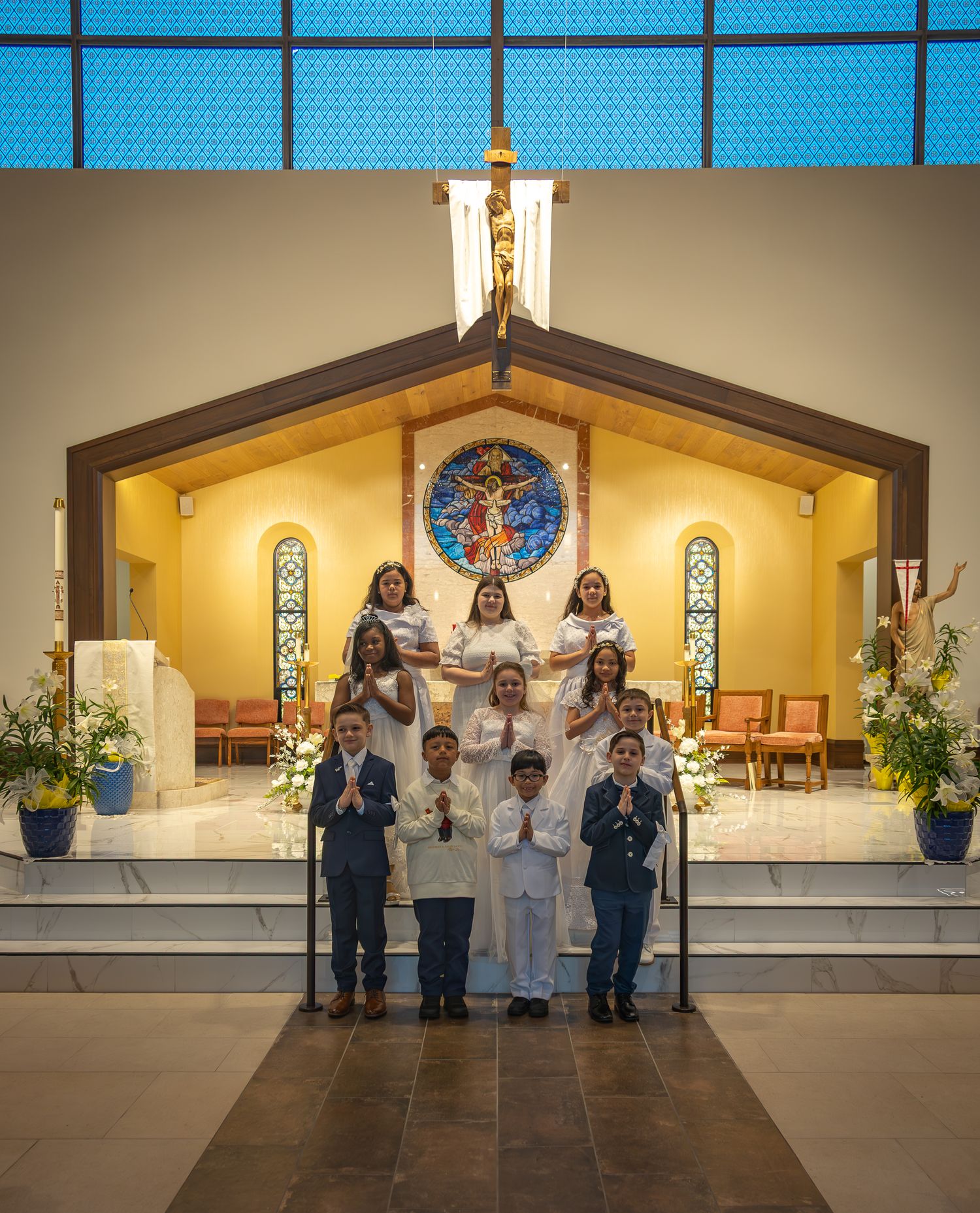 A series of photos showing a religious ceremony in a church with altar servers and clergy in white robes at the altar.