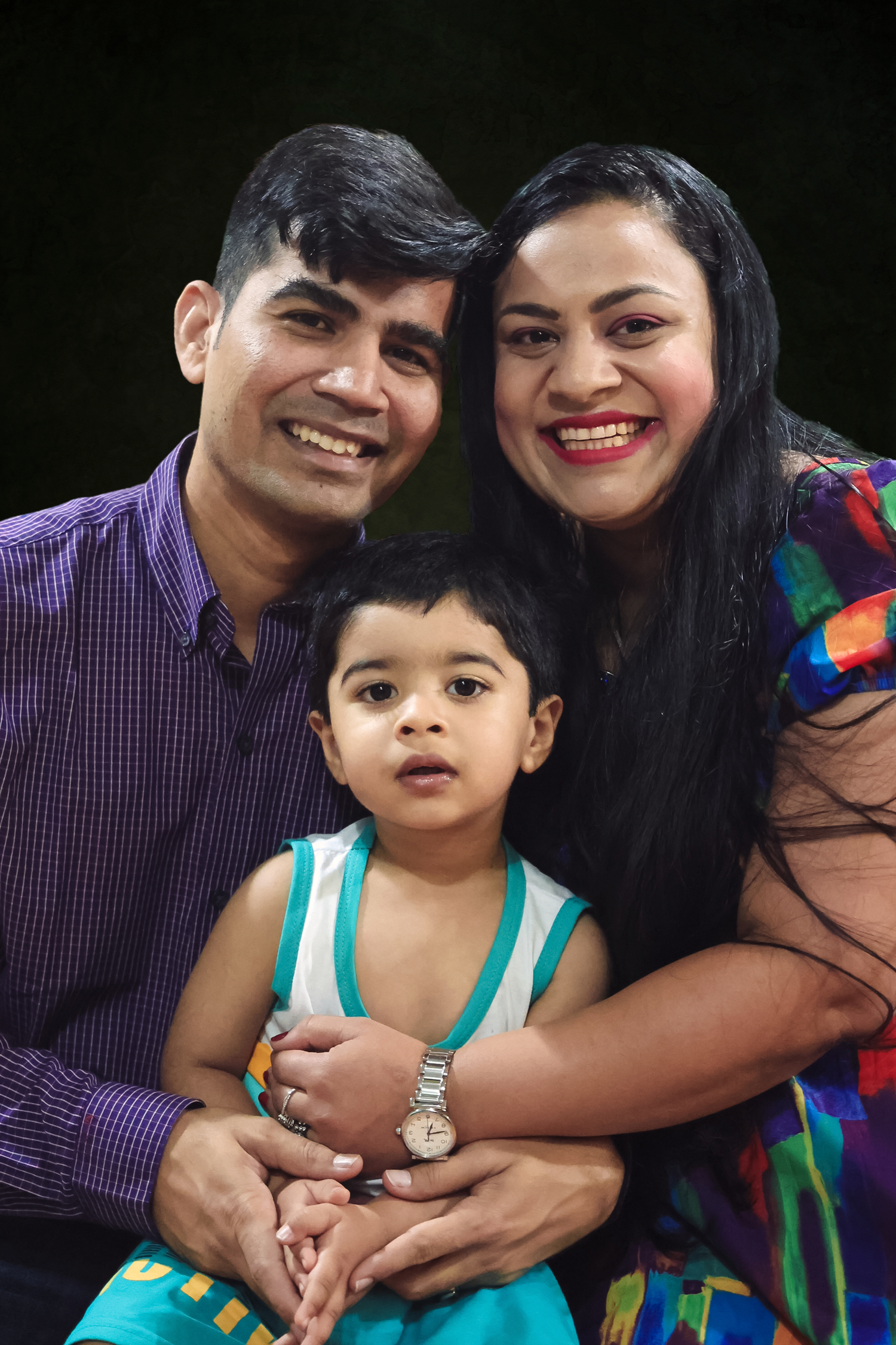 A family of three poses together in a series of candid shots showing their love and affection.