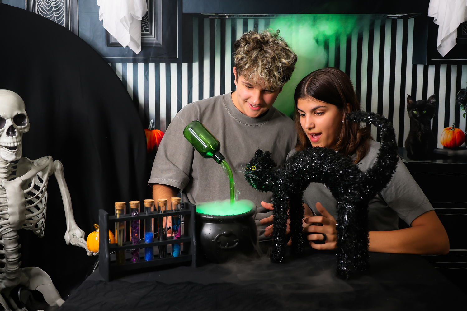 A group of people enjoying drinks and conversation at a dimly lit bar with green ambient lighting.