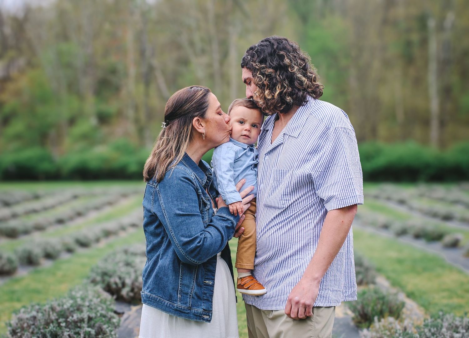 A couple shares romantic moments while walking through a beautiful lavender field on a spring day.