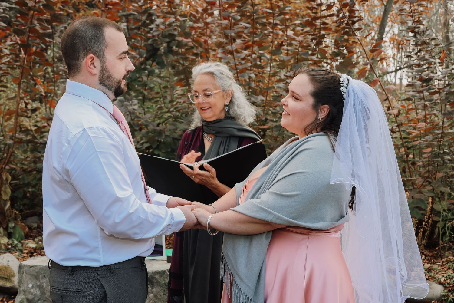 A wedding celebration sequence showing a couple dancing together in an outdoor autumn setting.