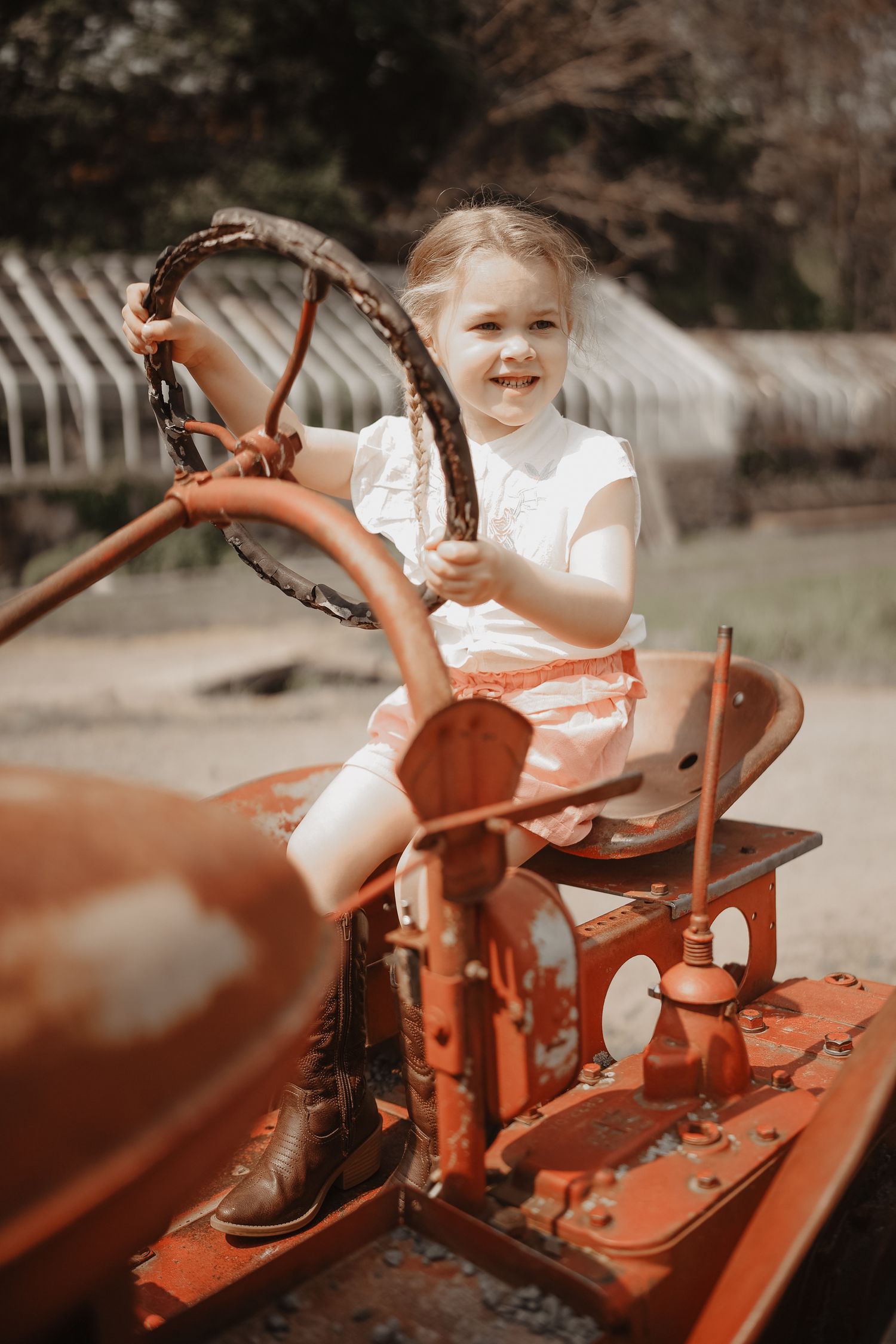 Series of photos showing a vintage red tractor in warm summer lighting.