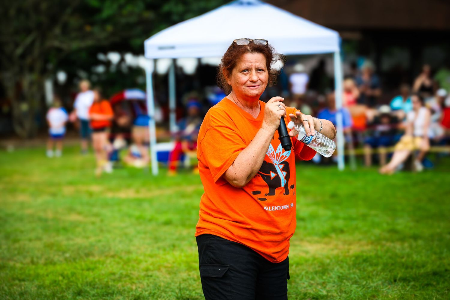A sequence of action shots shows a person in orange catching and throwing a frisbee disc on a grassy field.