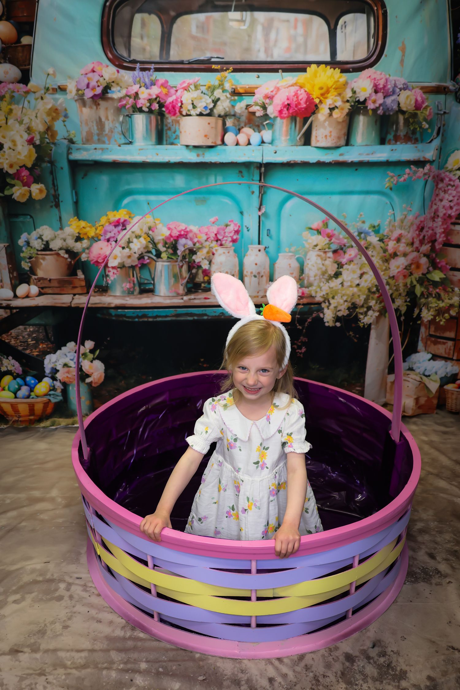 A series of photos showing a child sitting in a colorful boat-shaped prop surrounded by floral decorations and pastel colors.