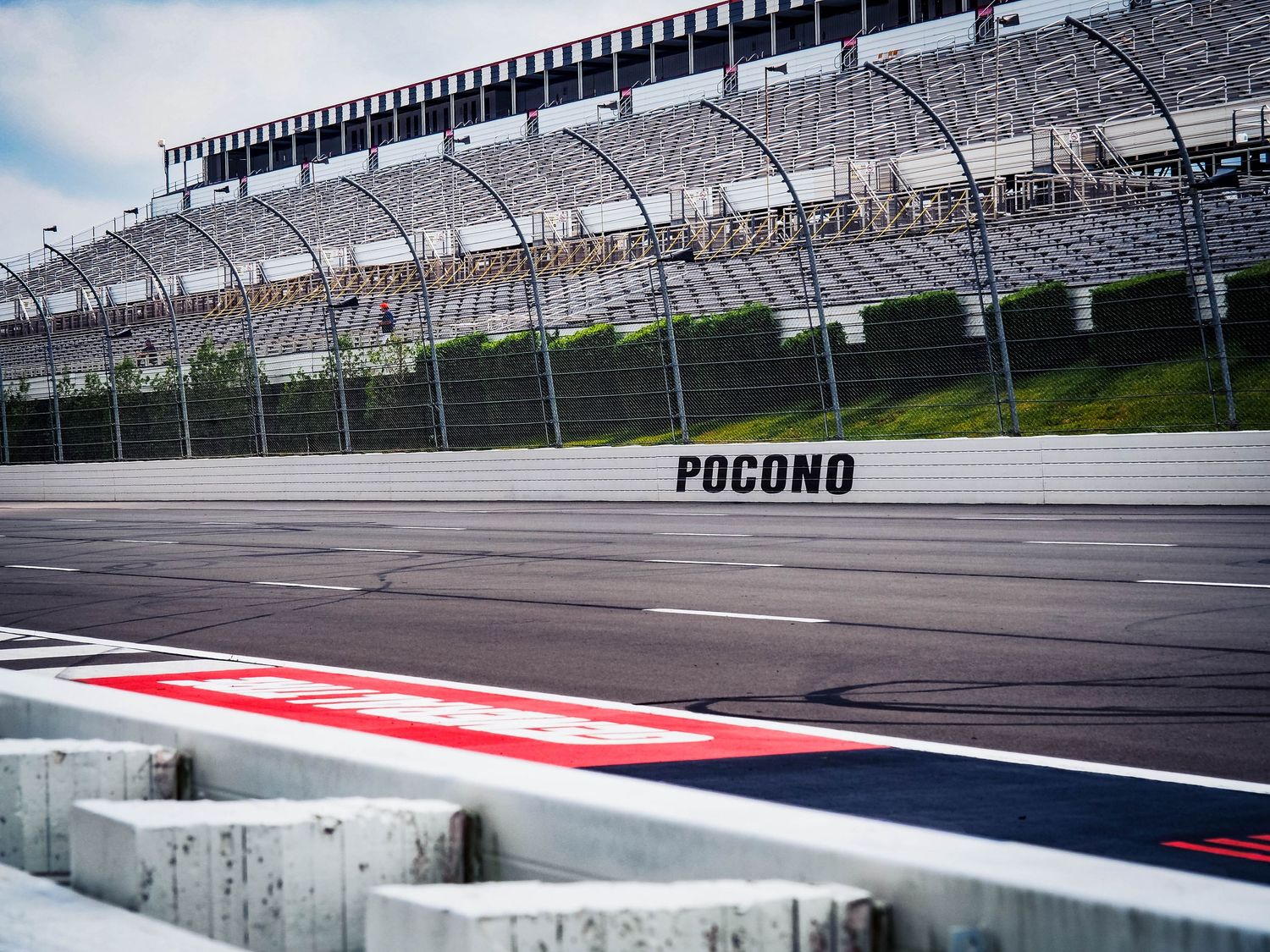 A sequence of racing track photos showing different angles of the Pocono Raceway with its distinctive red and white striping.