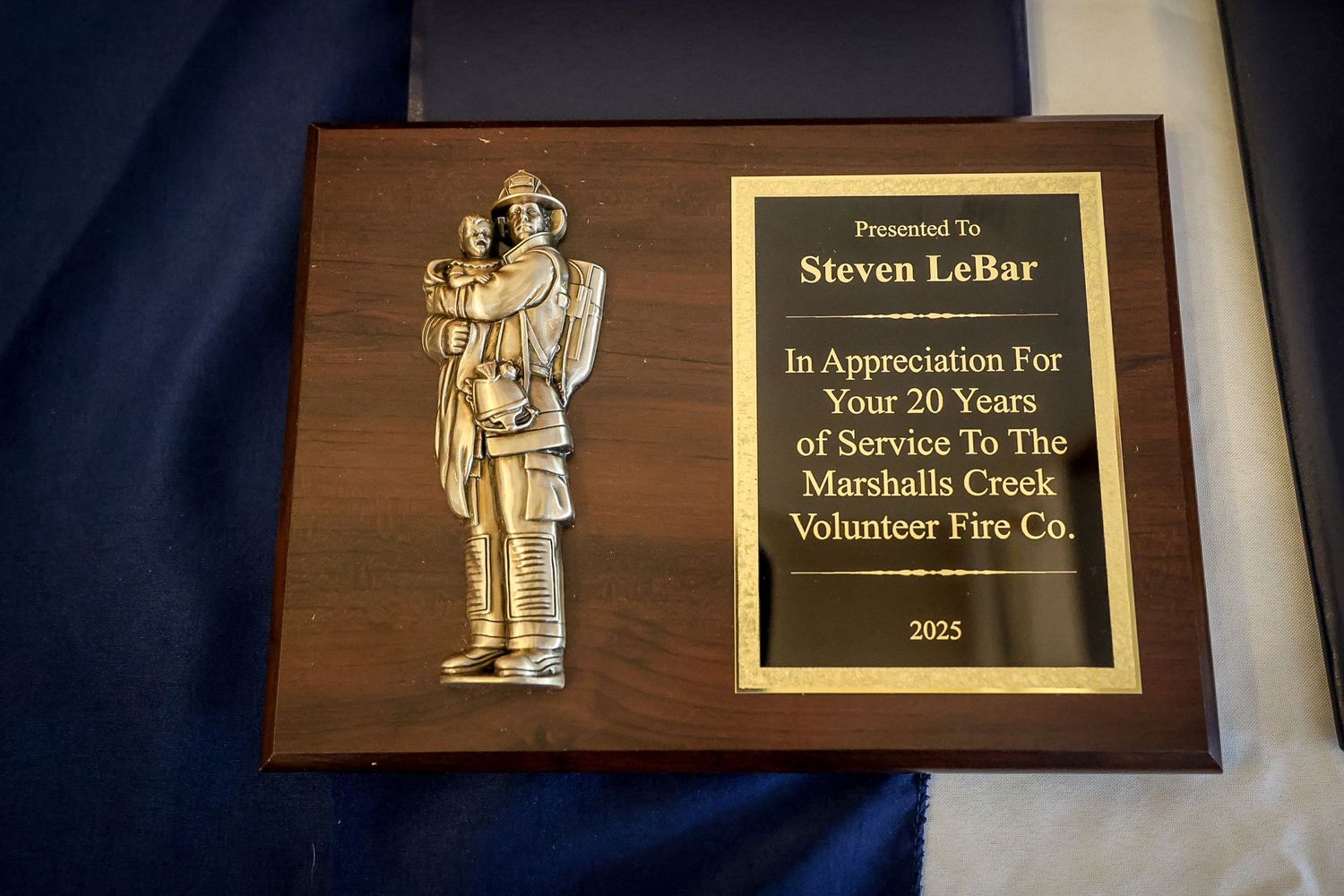 Wooden plaque honoring Steven LeBar for 20 years of service to Marshalls Creek Volunteer Fire Co., 2023.