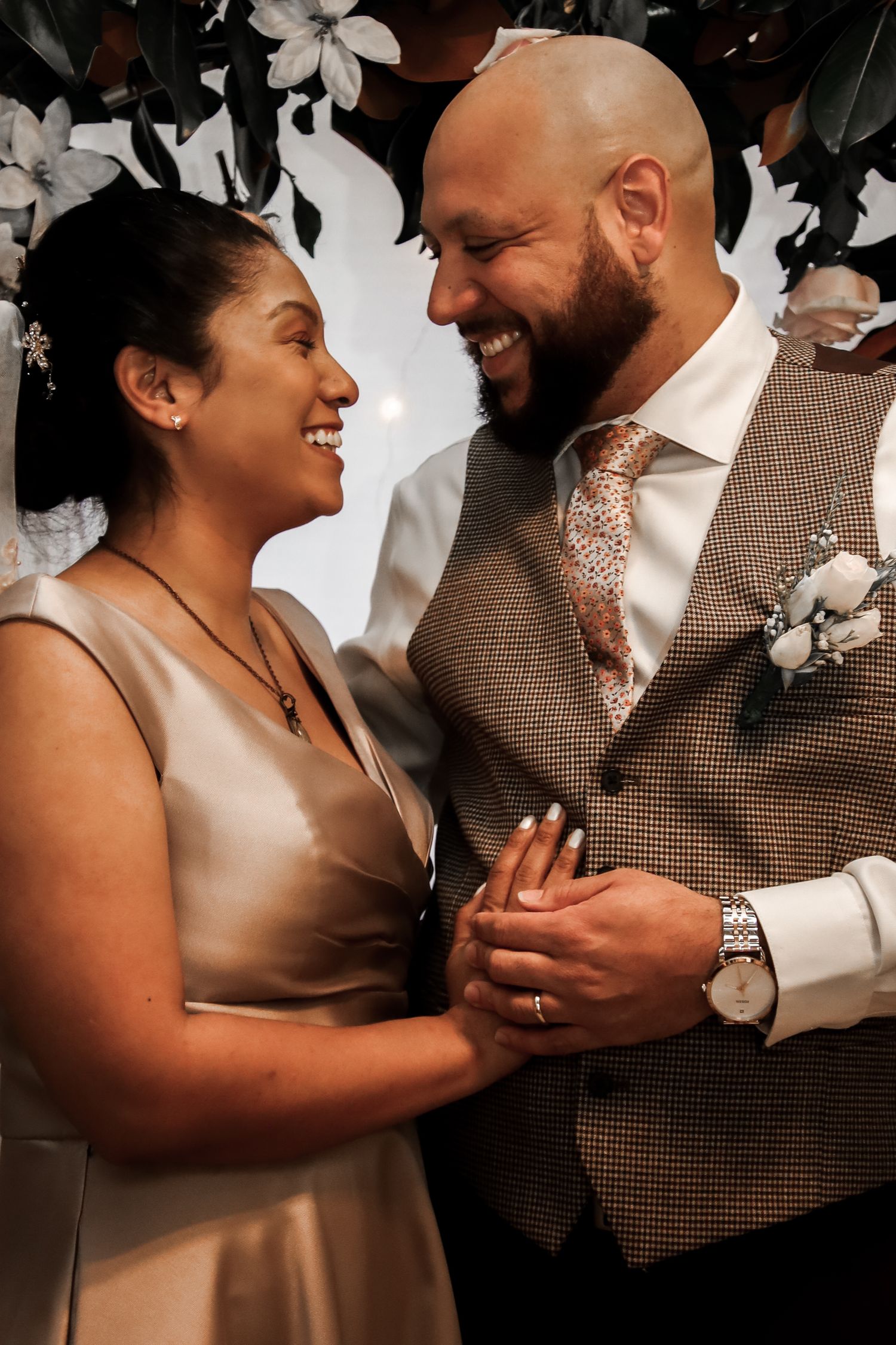 A series of candid wedding photos showing joyful moments between a couple dancing and embracing at their reception.