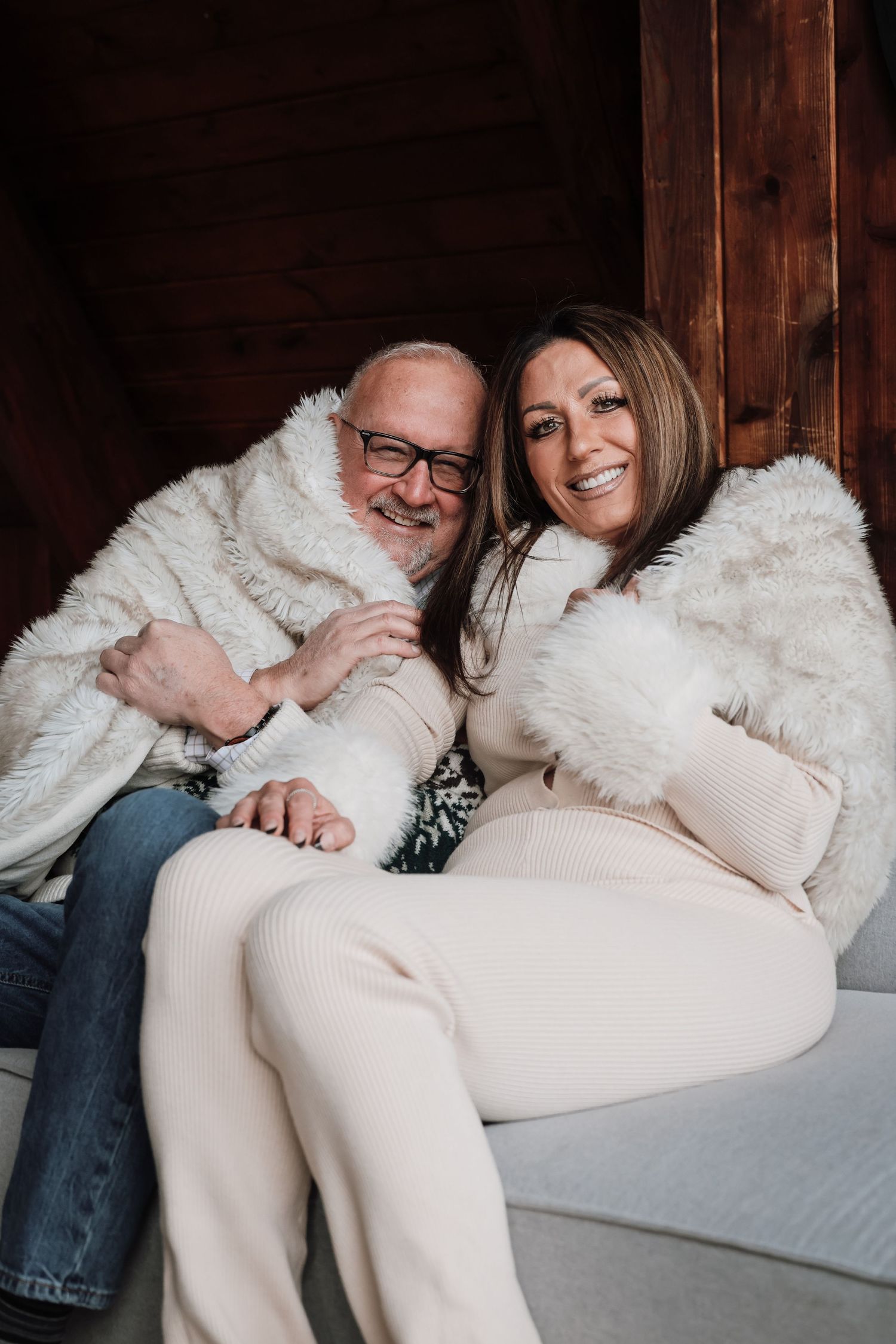 A couple sitting on a couch sharing intimate moments in a progressive sequence of candid photos.