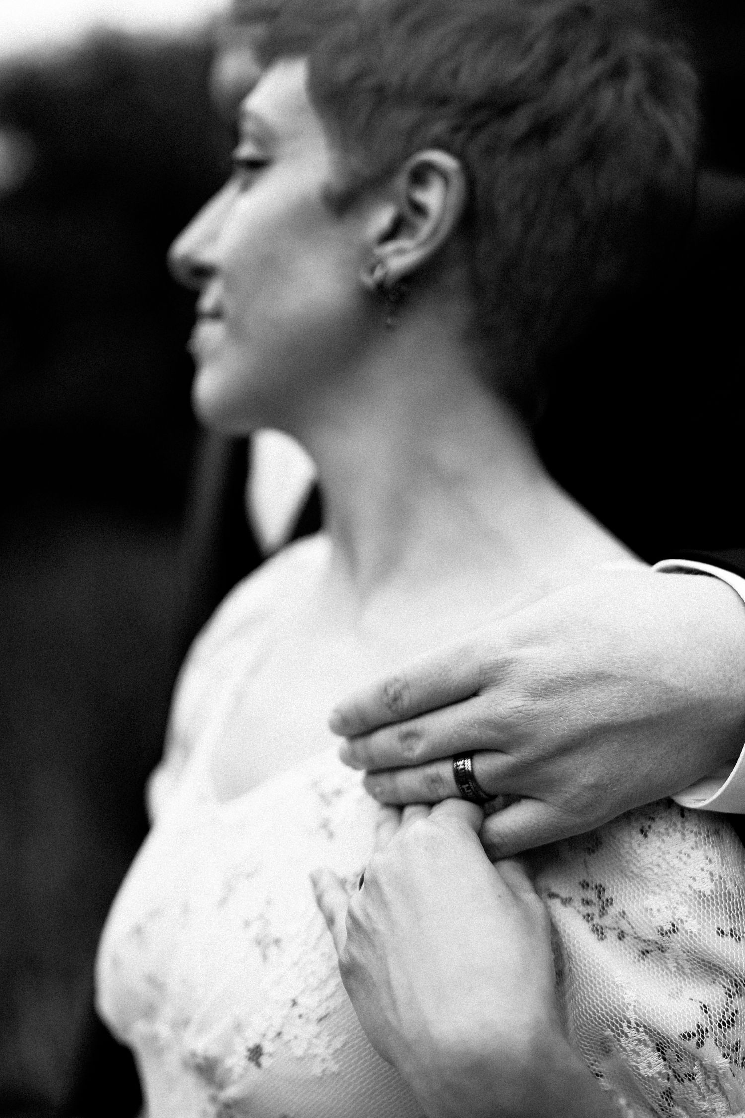 A black and white artistic photo series showing a person's neck and shoulder with delicate lace details on their dress.