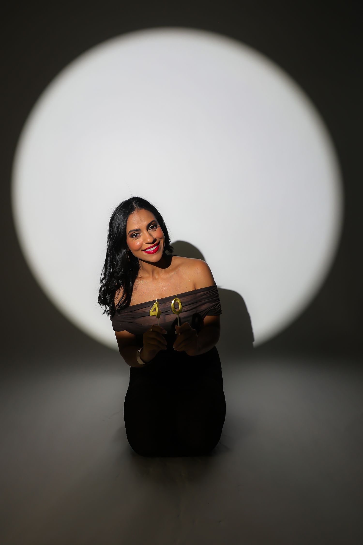 A dramatic portrait series on black background with oval spotlights creating a moody atmospheric sequence.