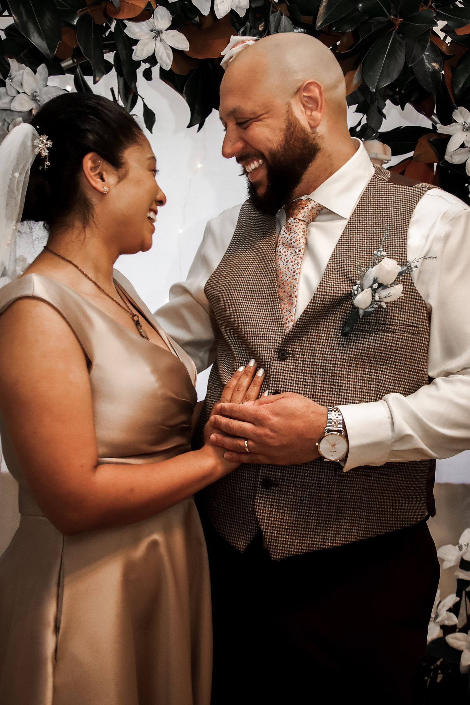 A romantic sequence of photos showing a couple exchanging rings during an intimate wedding ceremony.