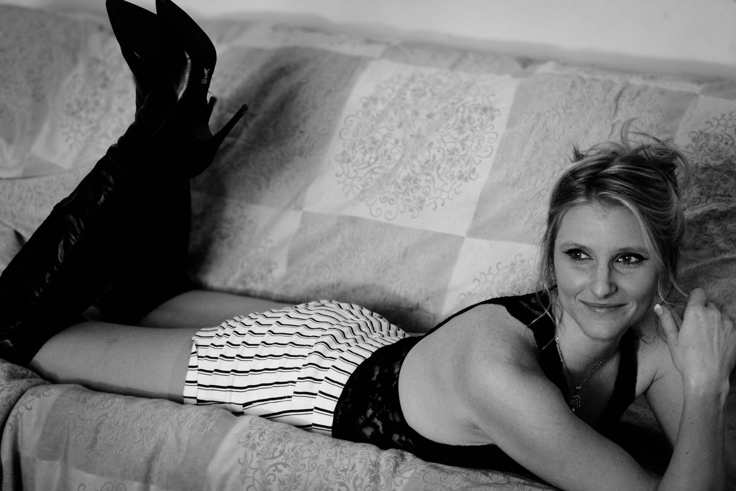 Black and white photo series showing someone lying on a bed or couch in various relaxed poses.