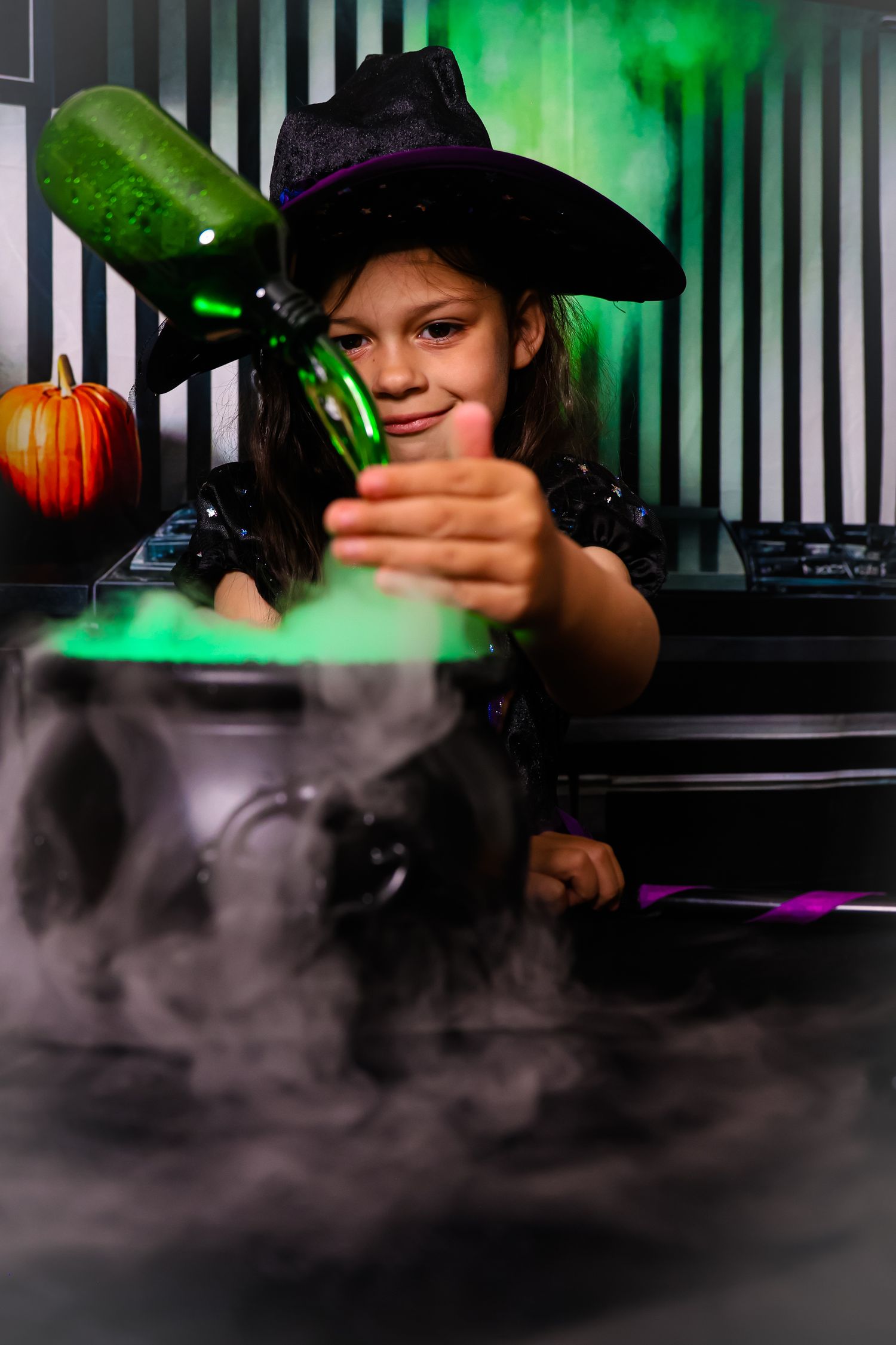 Atmospheric Halloween scene with toy gun and spooky green lighting through fog on dark background.