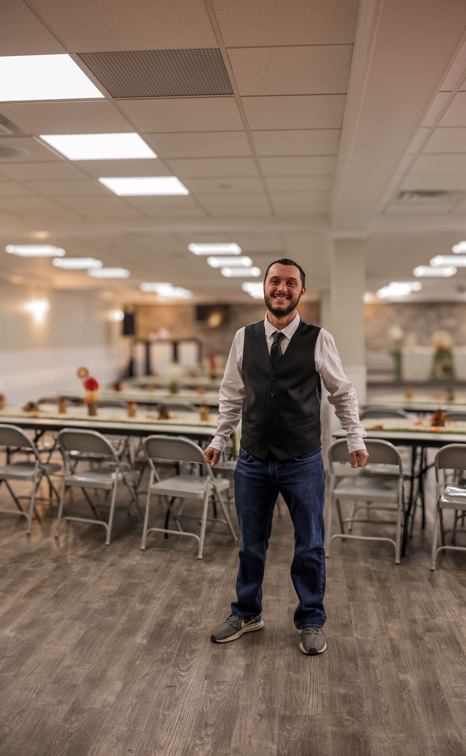 A sequence of photos showing movement across an empty cafeteria with wood flooring and folding tables.
