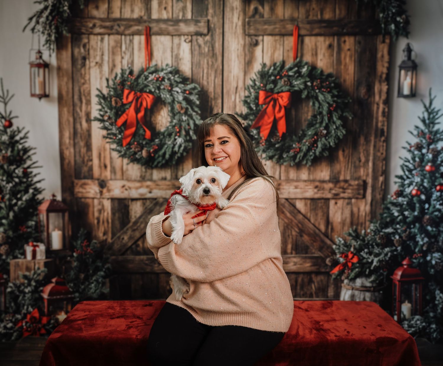 Holiday scene with rustic wooden doors, Christmas wreaths, and decorative elements.
