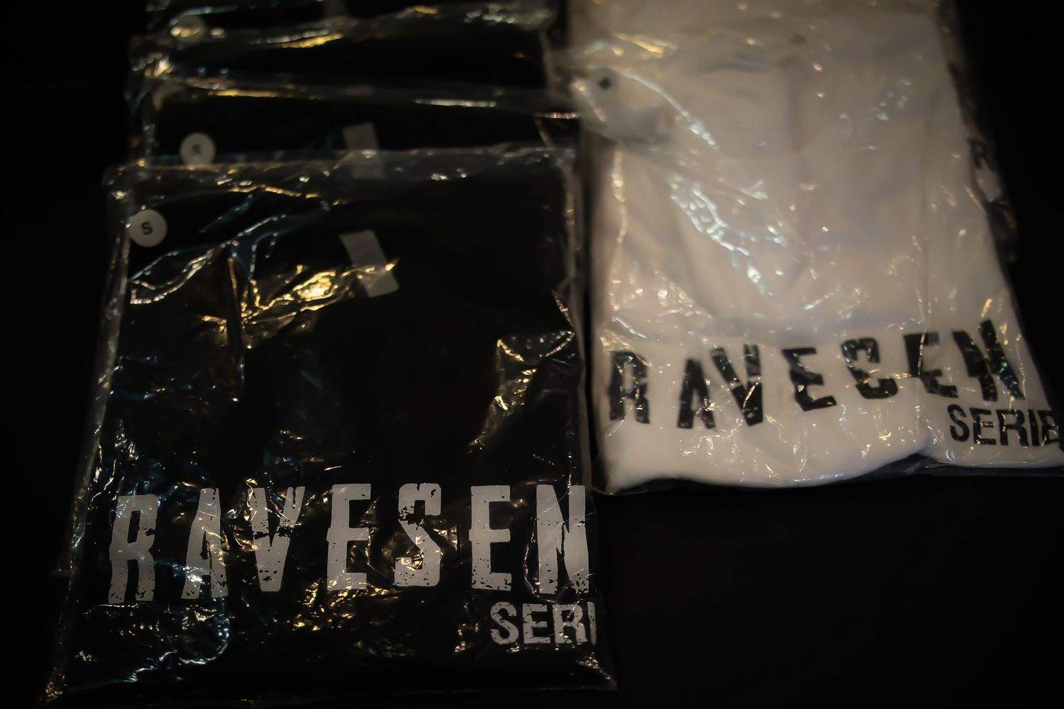 Black and white fragmented images showing a dark text or logo appearing to spell out 'HAVESEN' against a dark background.