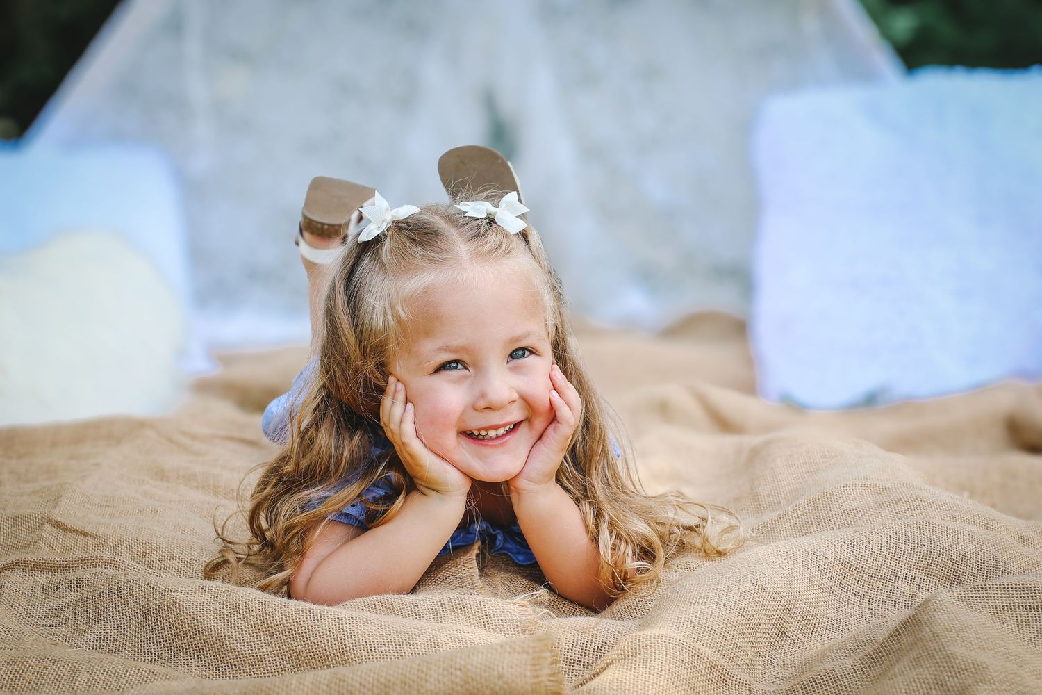 A series of candid beach photos showing playful poses and expressions on a sandy backdrop.