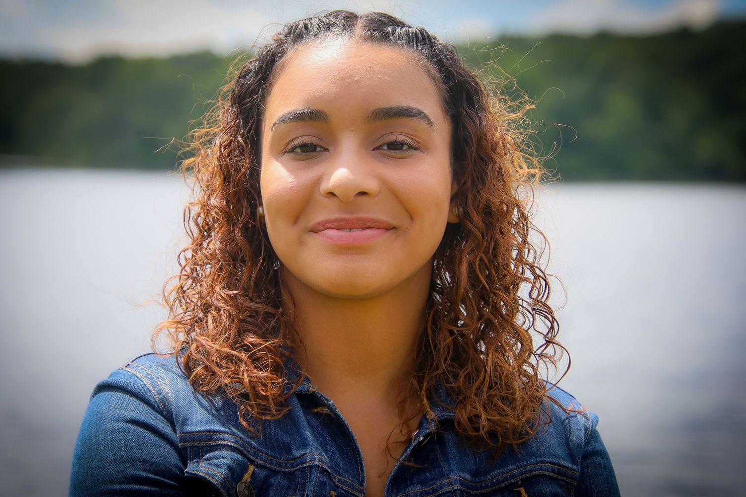 A sequence of photos showing someone with curly hair and natural makeup in various poses outdoors.