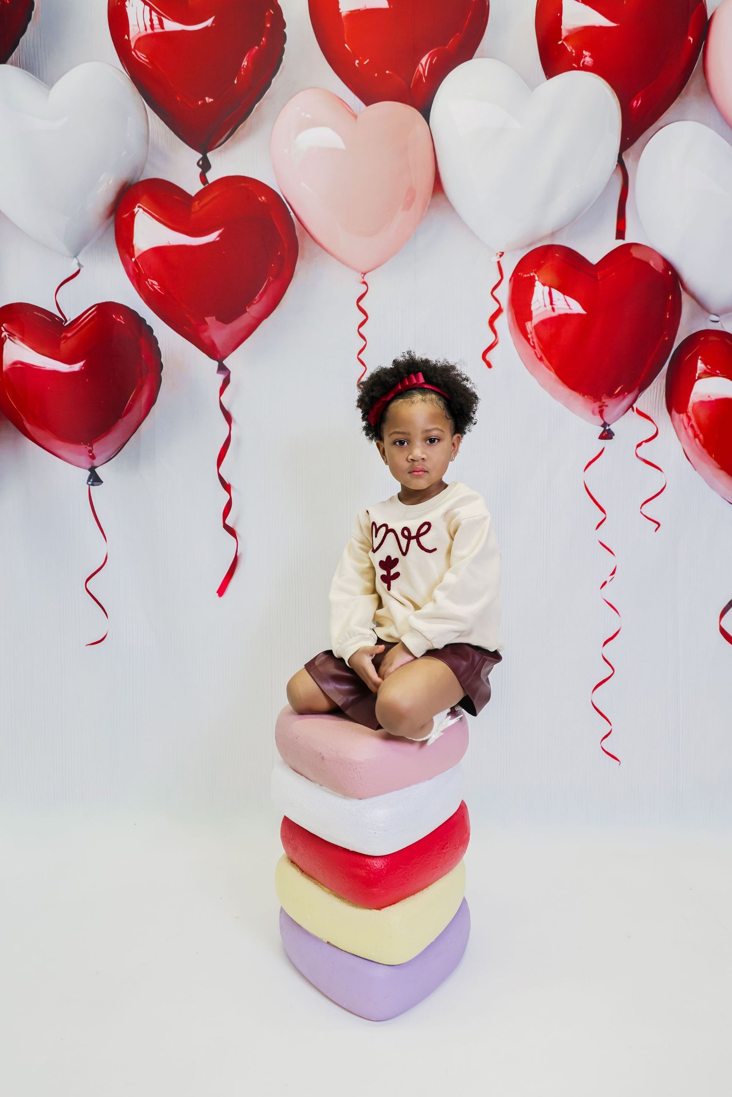 A series of Valentine's Day themed photos with red heart balloons and pink decor against a white background.