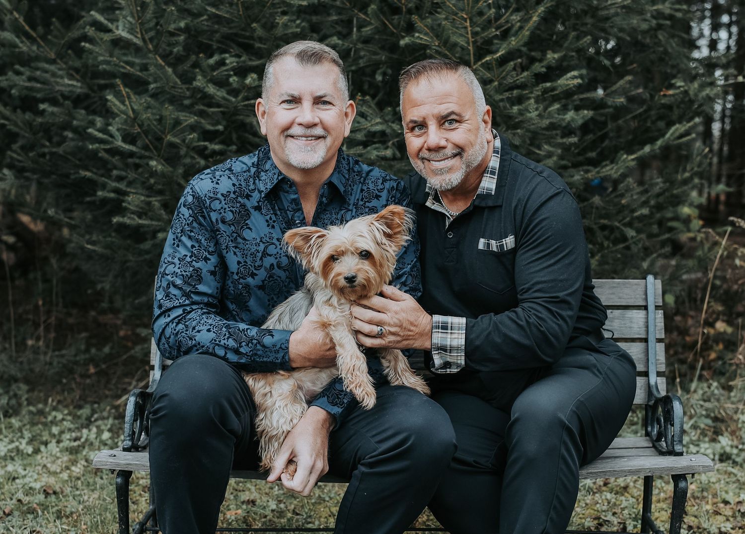 Two people in black clothing sit outdoors with a small brown dog in a series of casual portrait photos.
