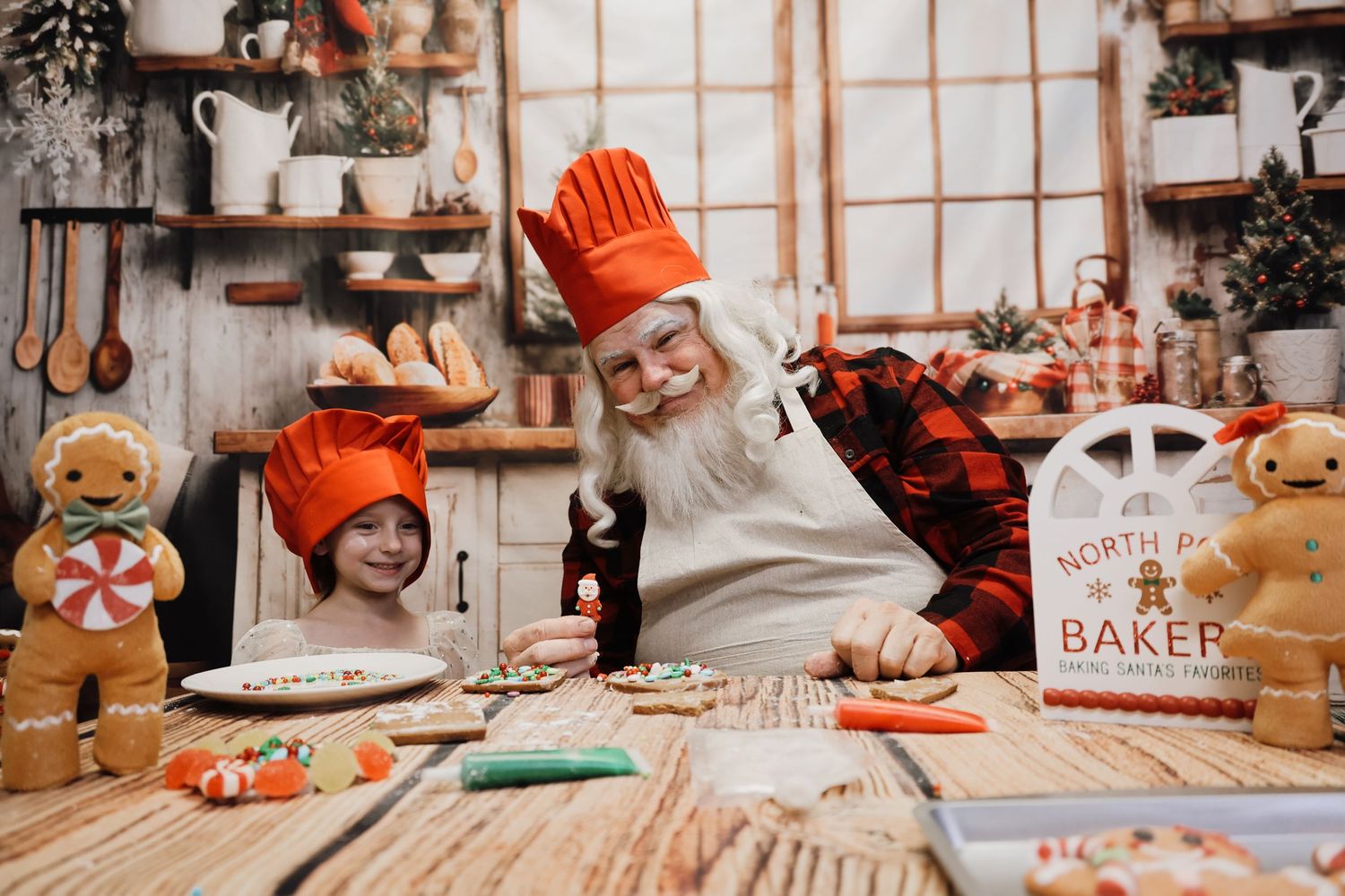 Cozy kitchen scene with orange gloves and baking supplies arranged on white tiled counter for holiday cooking.