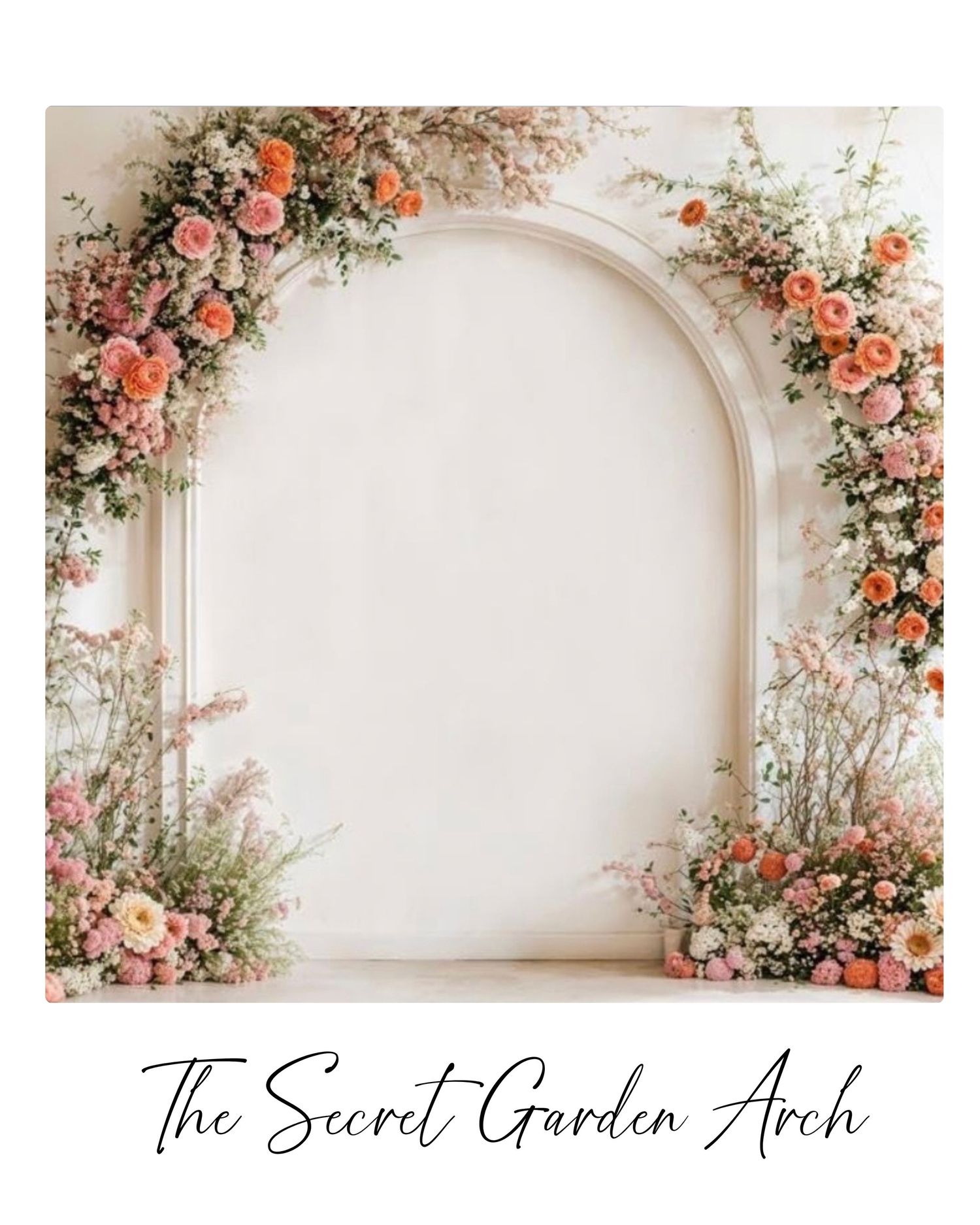 Elegant floral arch backdrop with pink and peach roses, greenery, and wildflowers framing a white arched wall.