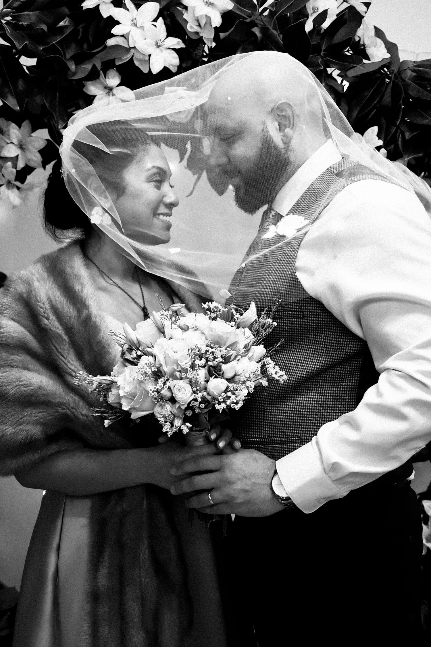 A romantic black and white wedding photo sequence showing a couple sharing tender moments with a bridal bouquet.