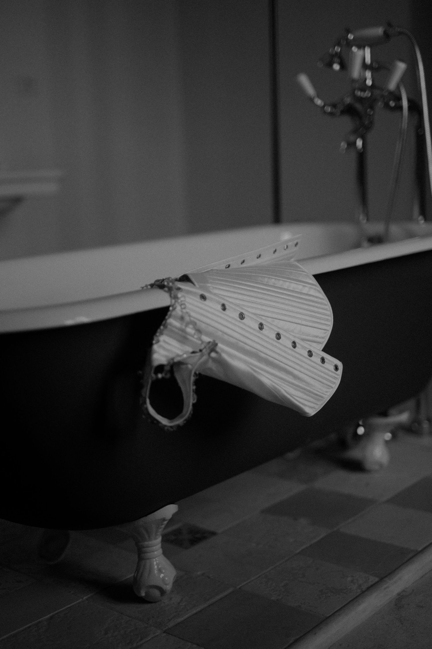 Black and white image sequence showing a mechanical wing or flap mechanism in motion.
