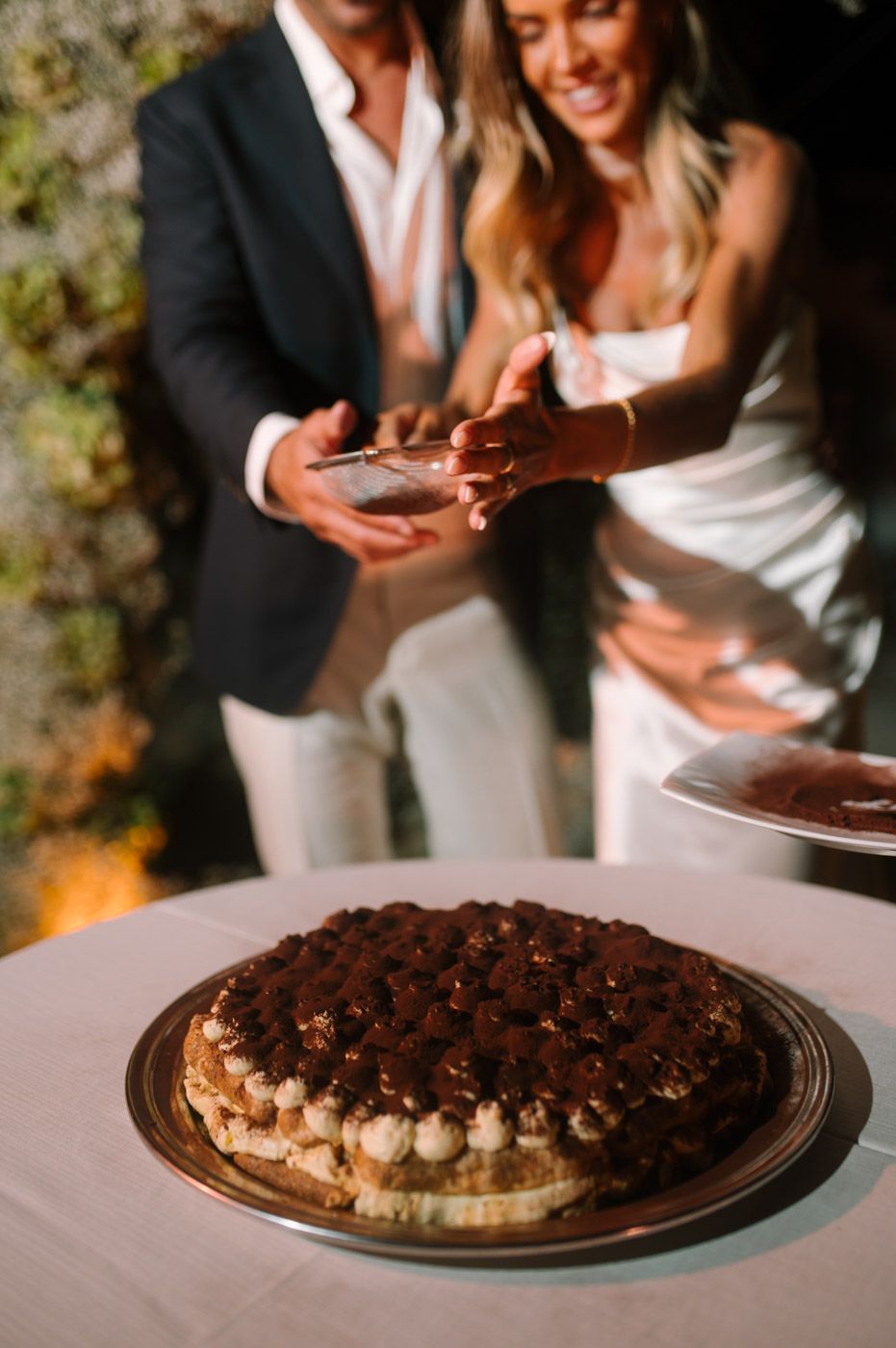 Wedding dessert table features an elegant chocolate pie with whipped cream topping.