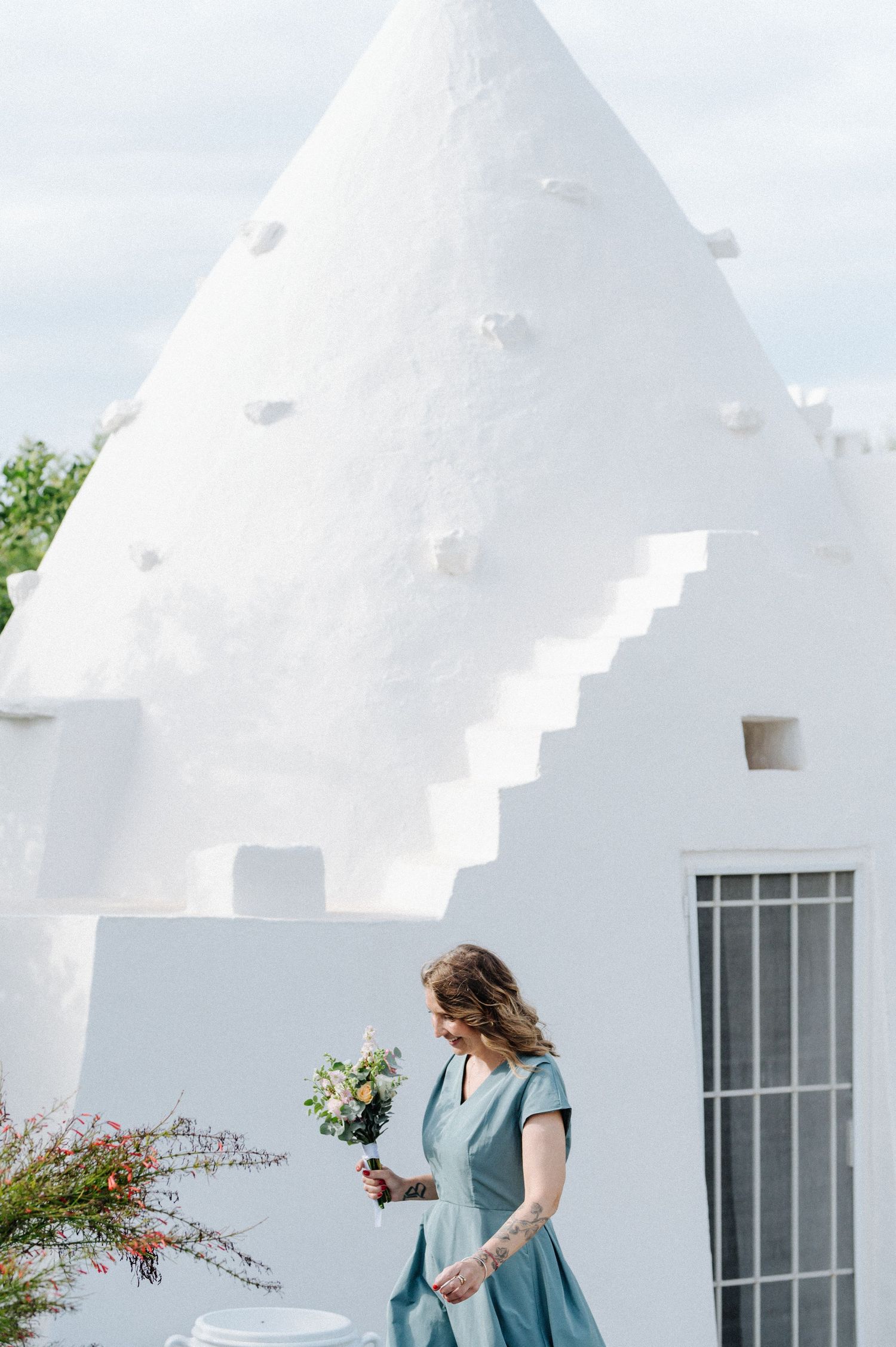 Pristine white buildings with stepped architecture and windows create a striking geometric composition.