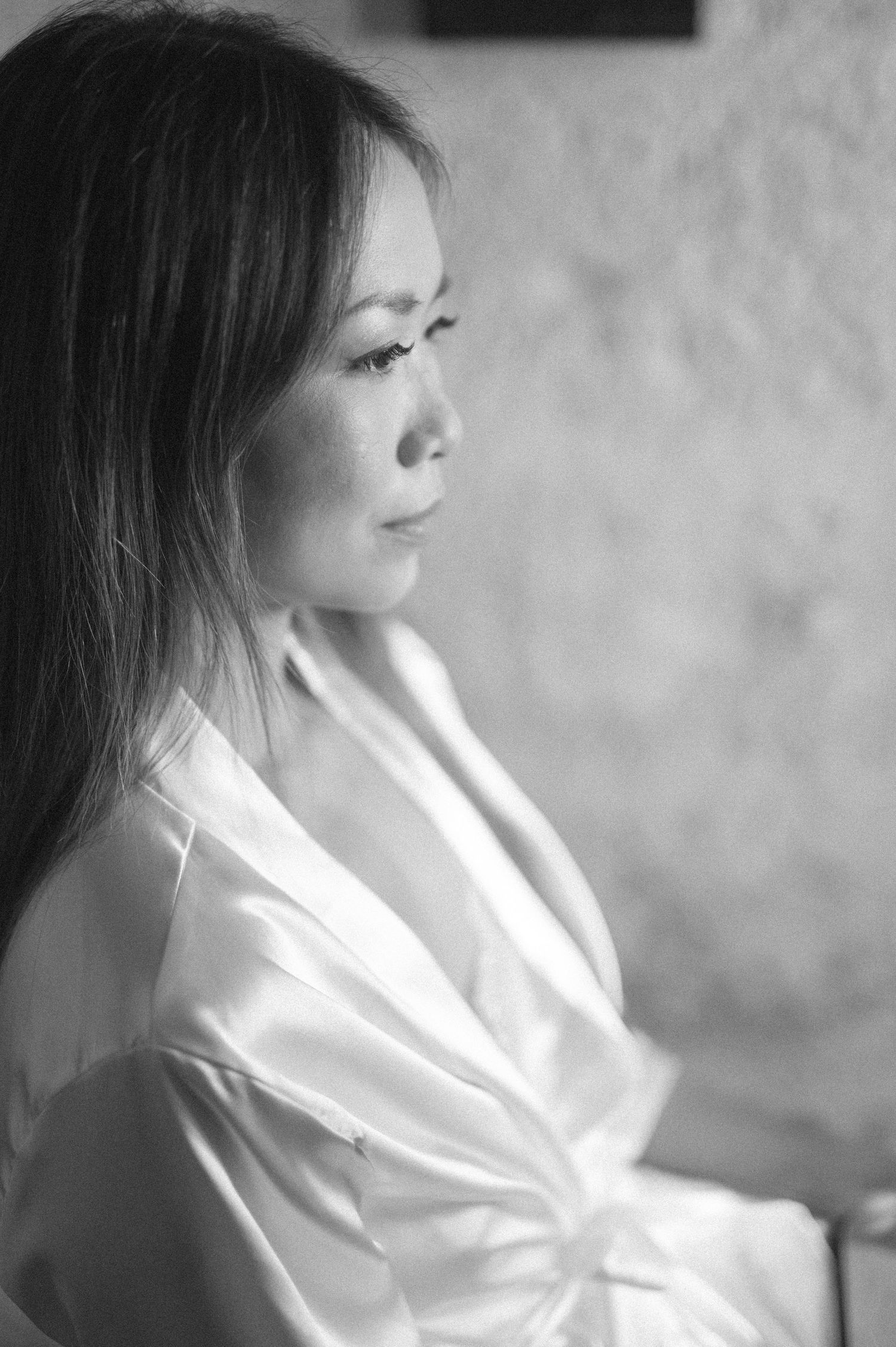 A series of black and white profile portraits showing a person in a white shirt gazing to the side in different angles.