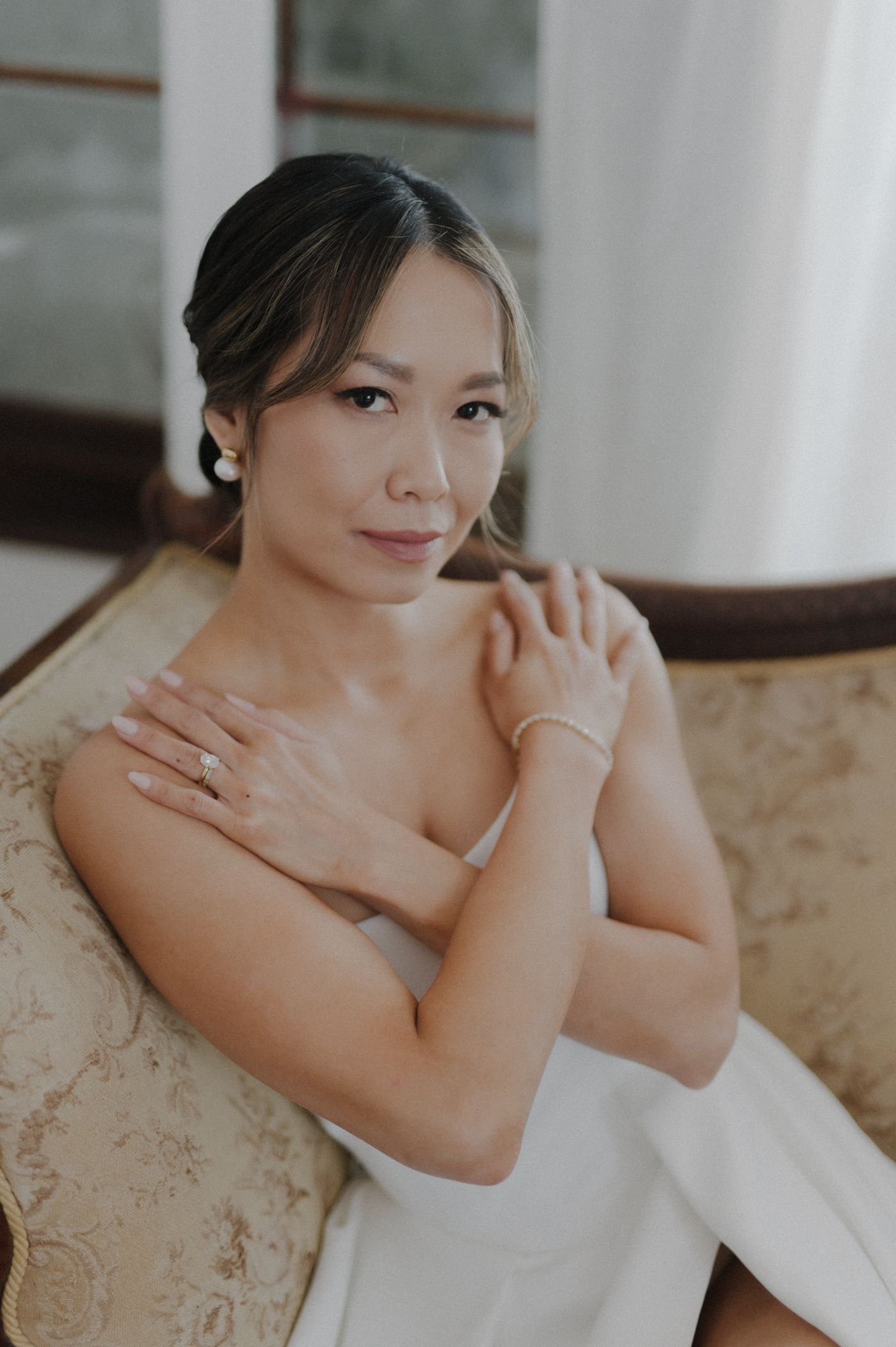 Elegant bridal portrait series showing intimate poses in soft natural light against white and beige background.