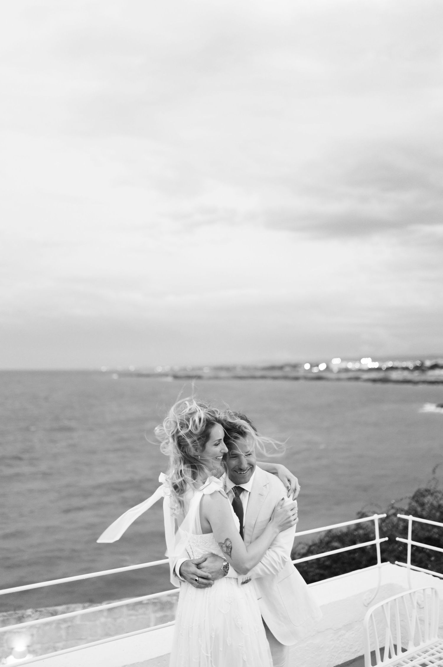 Romantic black and white sequence of a couple sharing intimate moments by the ocean.