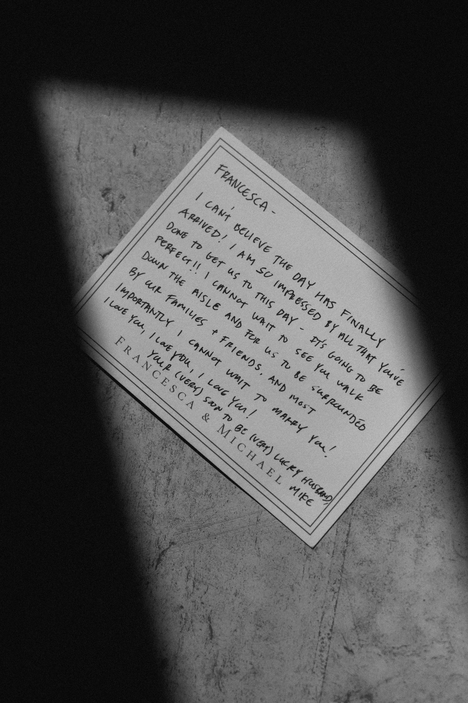 Black and white photo of a handwritten farewell note addressed to Francesca, signed by Francesca and Michael.