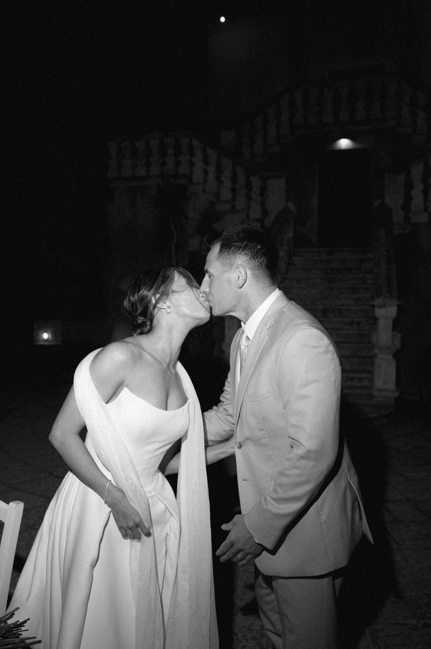 A series of romantic black and white photographs showing couples dancing and embracing at a formal event.