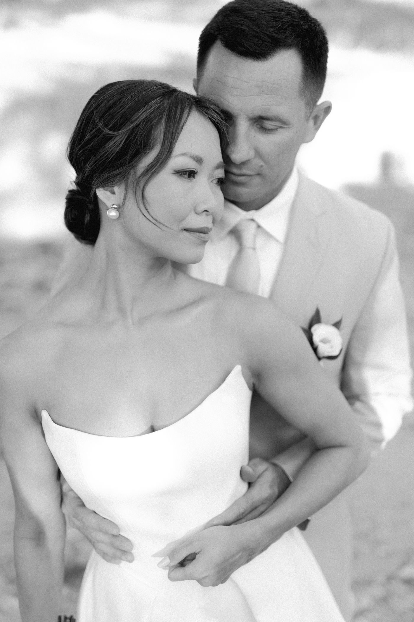 A romantic black and white photo series showing tender moments between a couple in wedding attire.