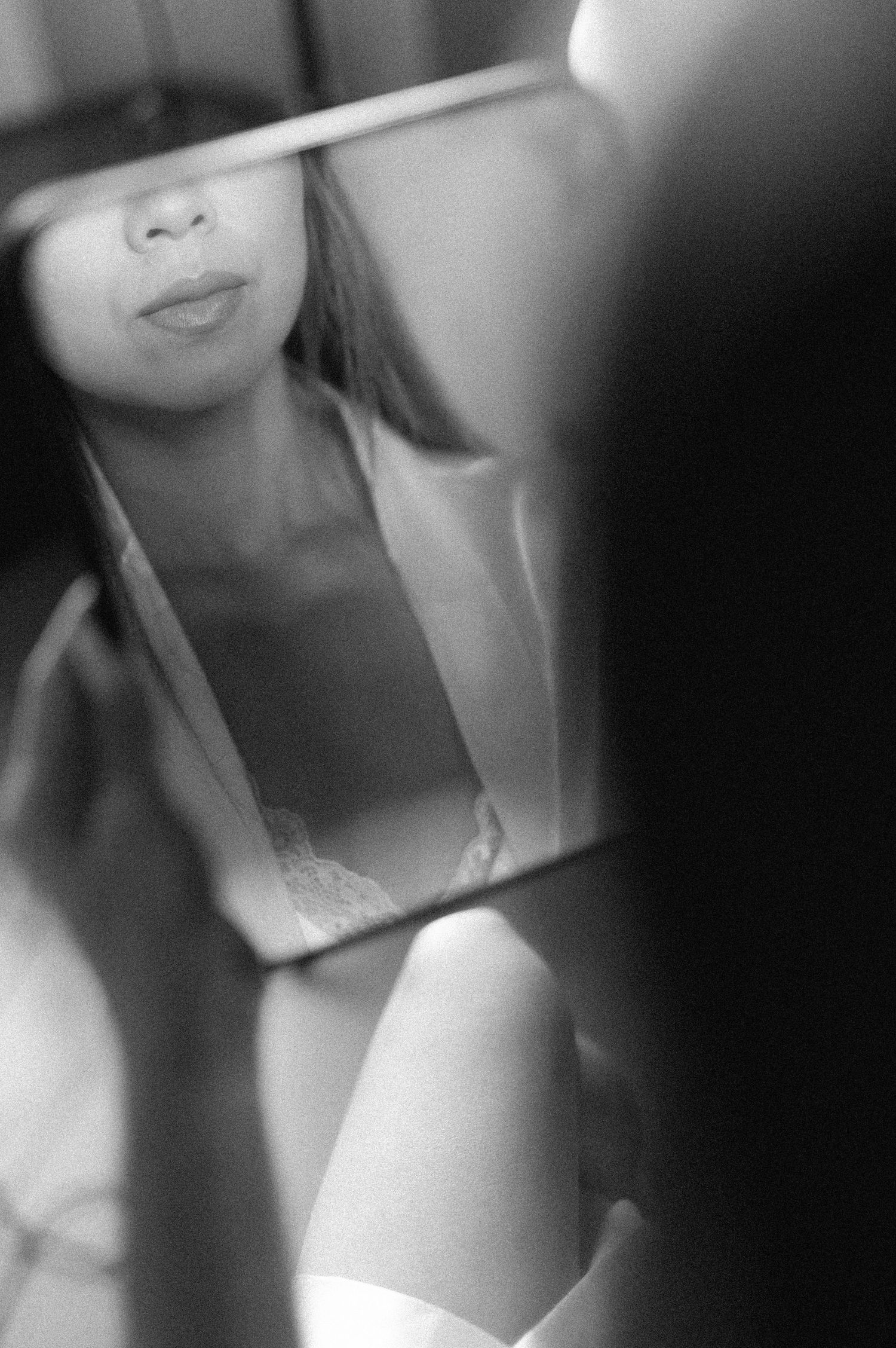 A series of black and white portrait photographs arranged in a row showing partial facial features in soft focus.