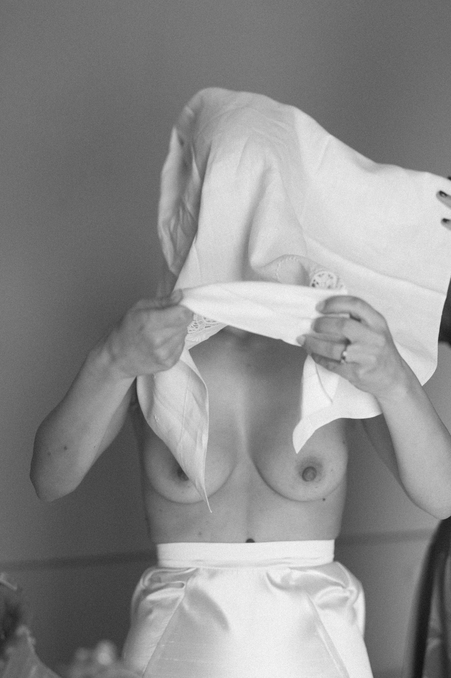 Black and white artistic photo sequence showing white fabric movement.