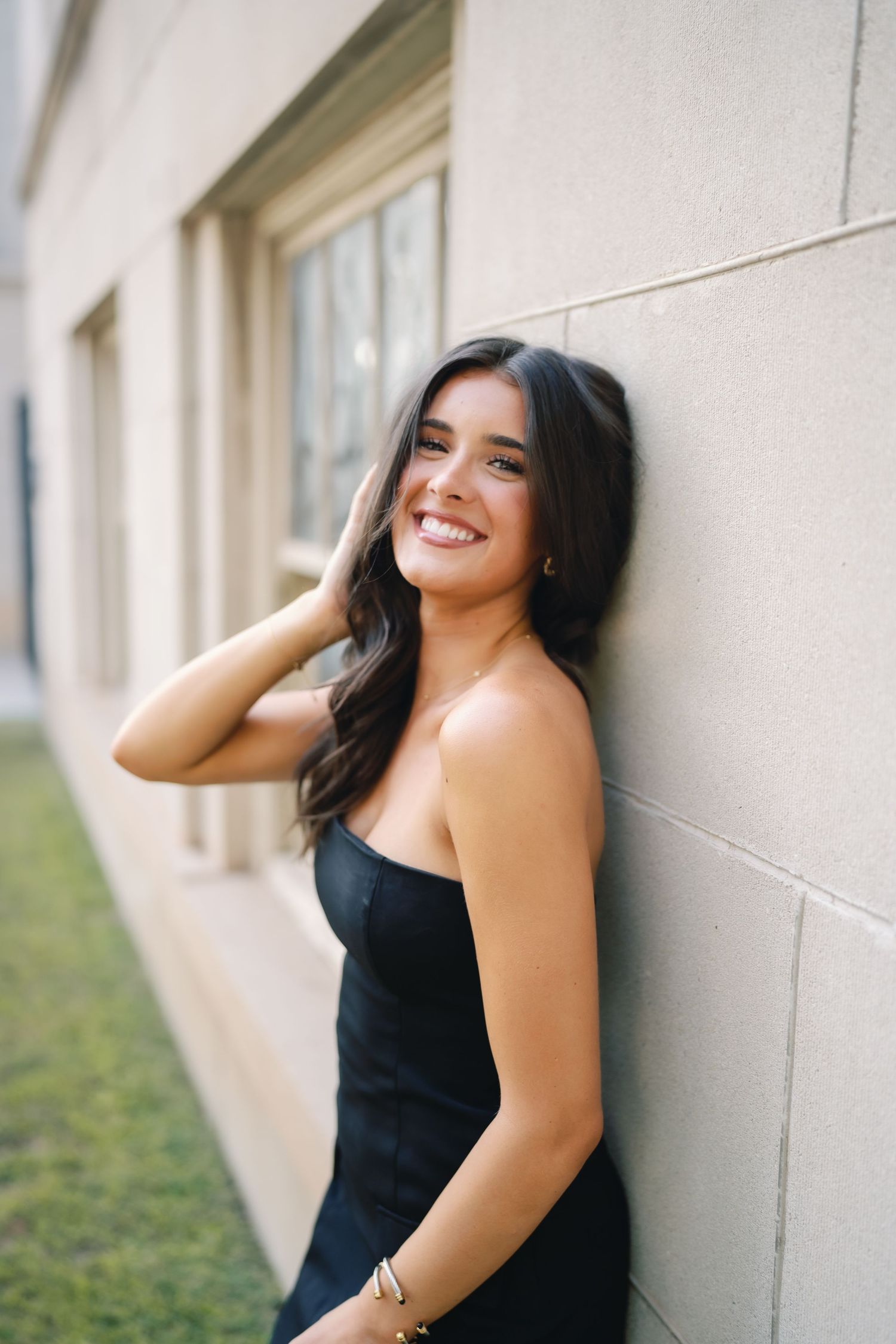Portrait series against a white wall showing joyful expressions and poses.