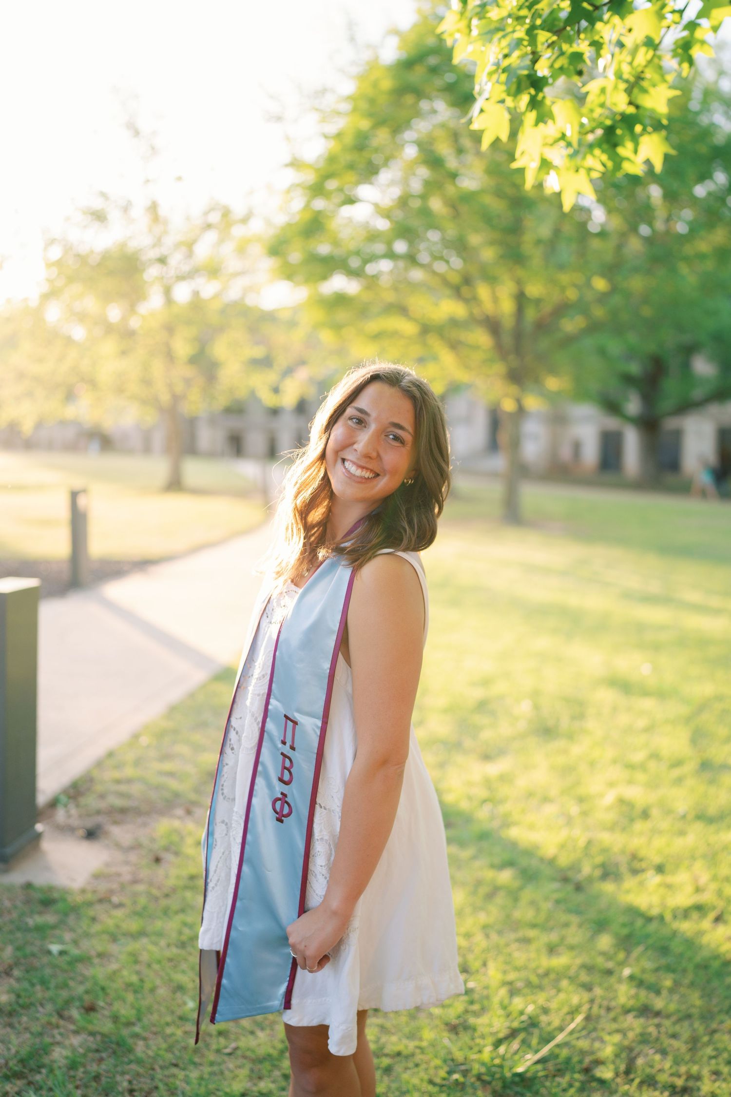 Sun-drenched portrait session in a park during golden hour with natural lighting.
