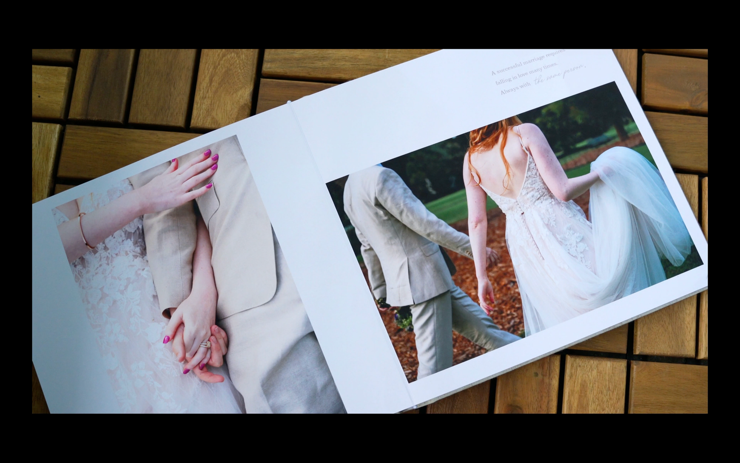 Open wedding photo album displaying two romantic couple portraits, showcasing elegant bridal gown and suit details.