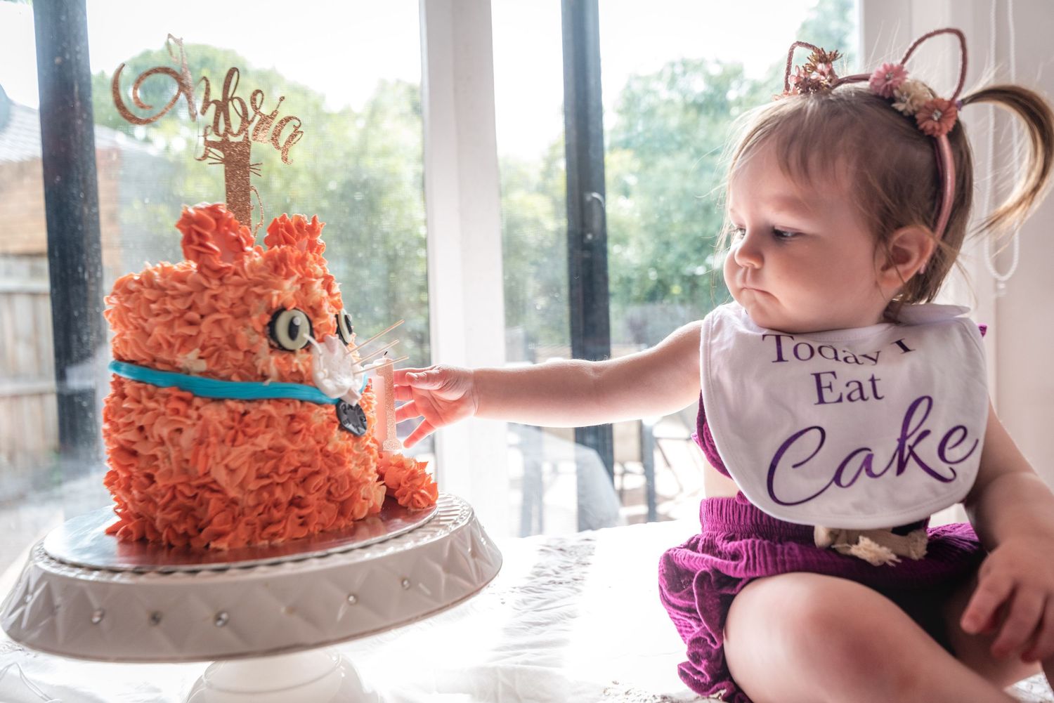 A collection of cake decorating photos showing a white and orange cake being assembled and decorated with frosting details.
