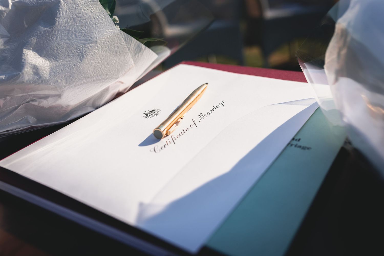 A series of blurry images showing papers and documents laid out on a surface with text visible.
