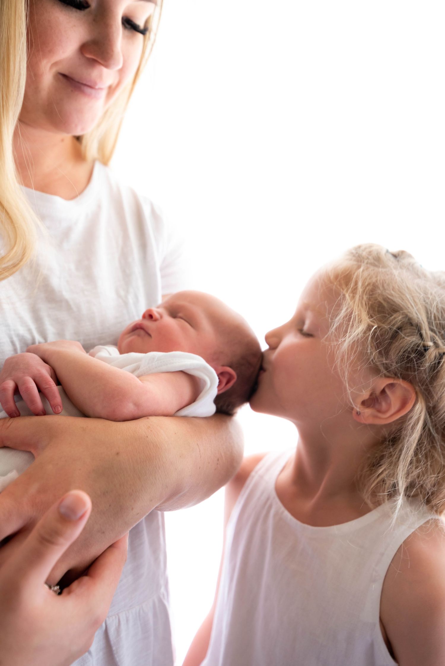 A series of four connected images showing a gentle massage therapy treatment in a bright, clinical setting.