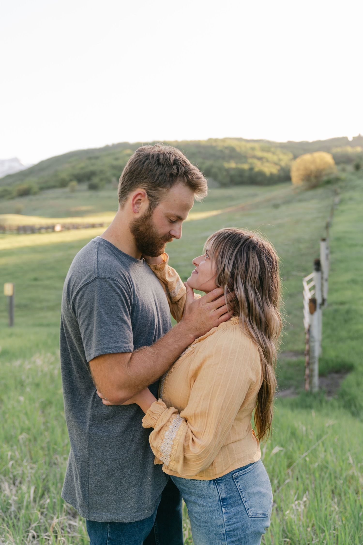 Couple enjoying a country-themed session in Utah, captured with natural light and timeless, true-to-color photography.