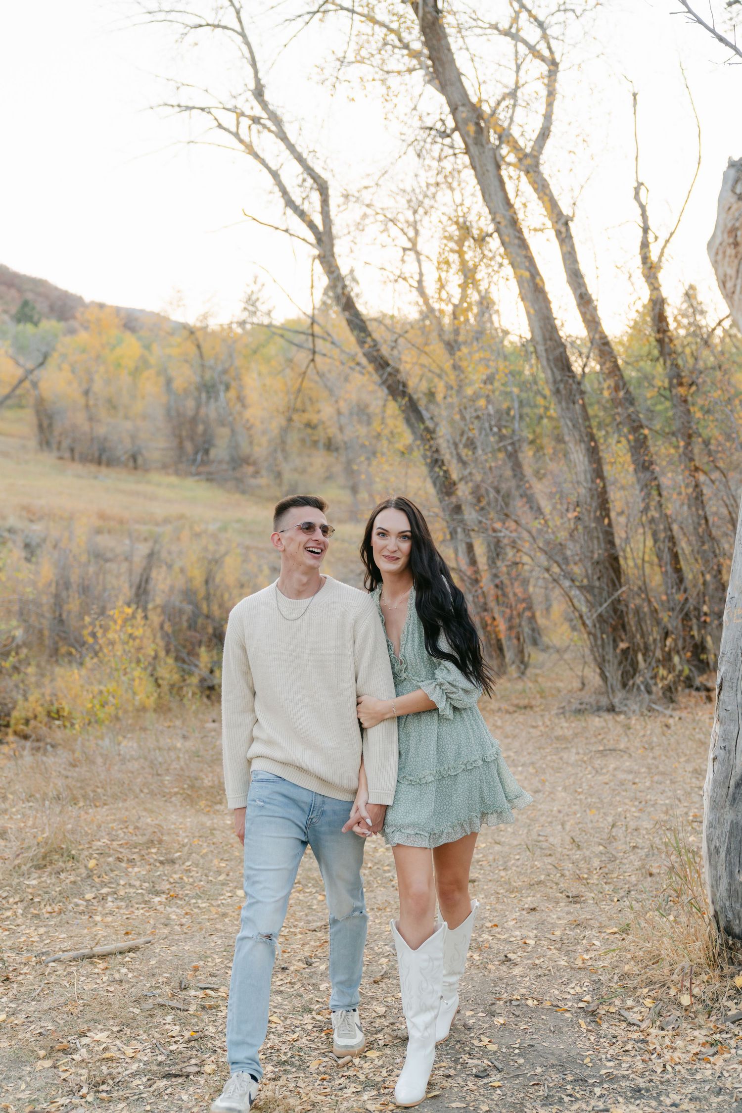 Couple candidly posing on the North Alt Trail in Utah, captured with natural light and timeless, true-to-color photography.